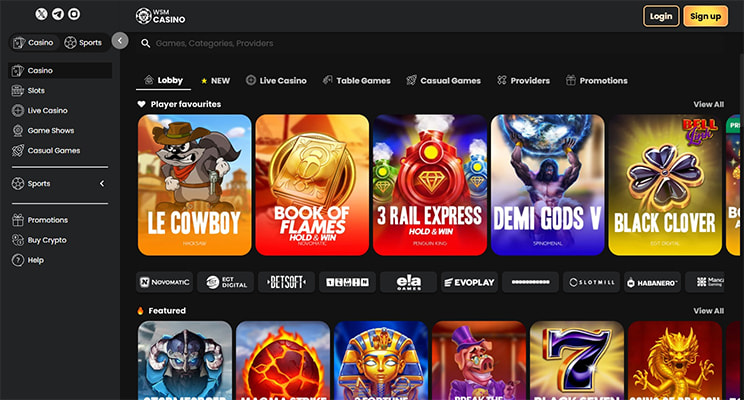 WSM Casino lobby displaying player favourites including Le Cowboy, Book of Flames, 3 Rail Express and Demi Gods V slots